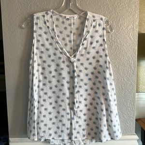 Sleeveless flowing blouse has front tie Size L Brand- hashttag. Colors wte/blue